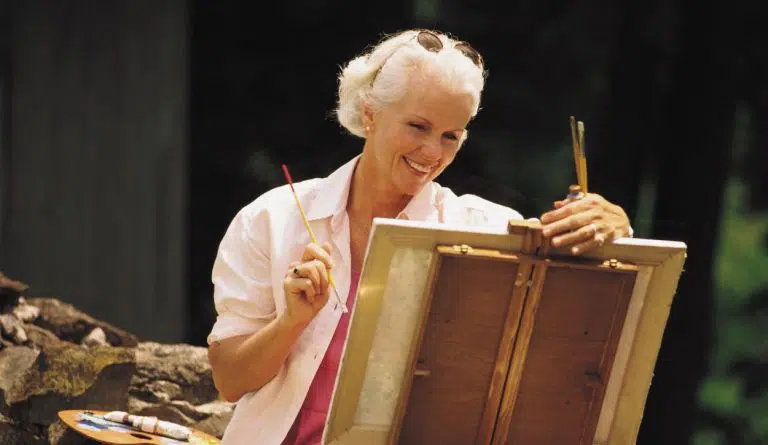 woman smiling artist painting